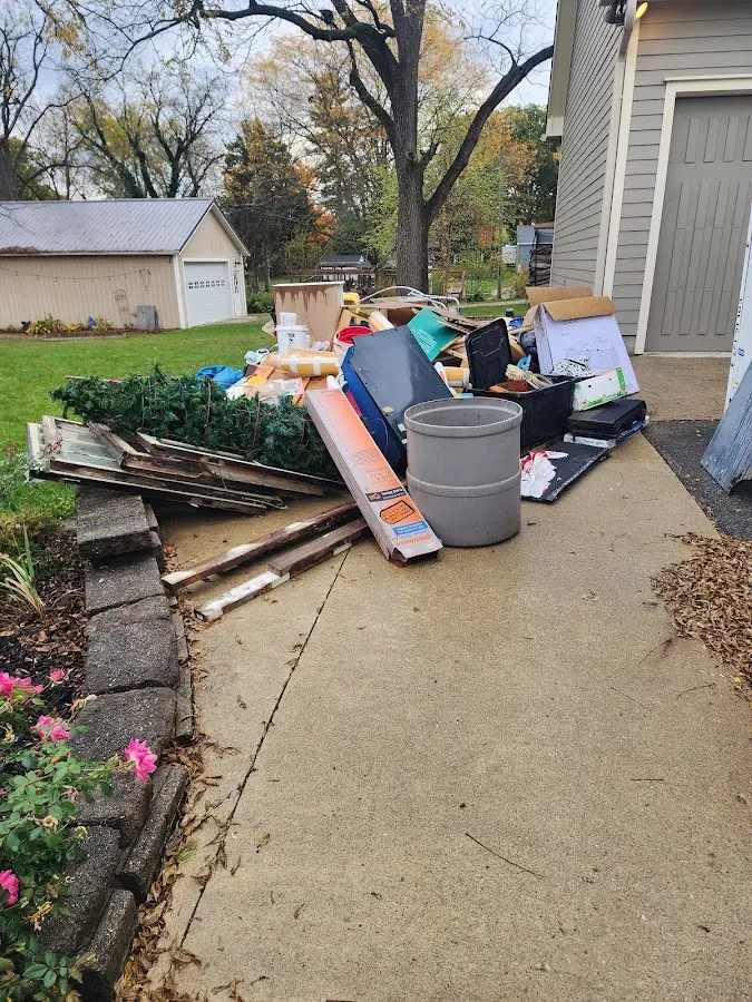 Dumpster being loaded with debris for 3 Yard Dumpster Rental in Midway City